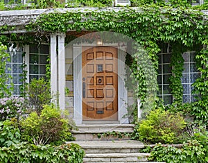 Front door of house surrounded by ivy