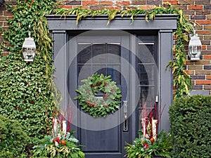 Front door with pine wreath