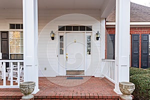 Beautiful white Front door and porch of a residential home photo