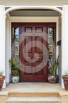 Front door, view of front door accented with plants