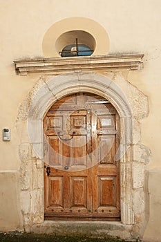 1500s, six panel, brown, arched, wood, front door, in Sablet France photo