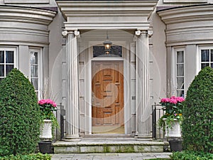 Front of elegantly landscaped house