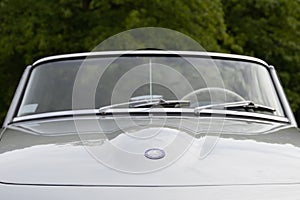 Front emblem of a Mercedes-Benz 190 SL cabrio german oldtimer car at the Cars & Coffee event at the Mercedes-Benz Museum