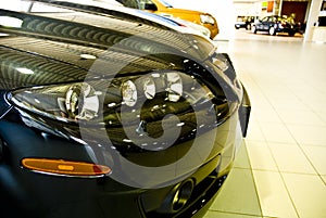 Front end of cars in showroom