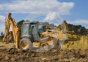 Front end loader with backhoe