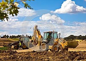 Front end loader with backhoe in action