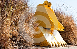 Front End Loader Buckets in Dry Grass