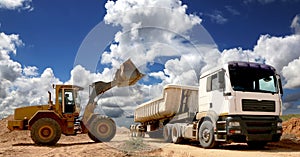 Front End Loader Filling Truck