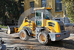 Front end loader at the road construction