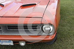 Front end of plymouth cuda with crack on the bumper