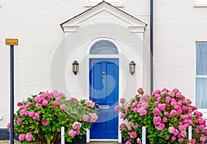 Front of English house decorated with flowers