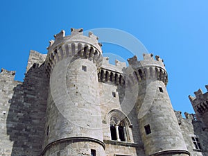 Front and entrance to the medieval palace of the grandmasters in rhodes town against a blue summer sky
