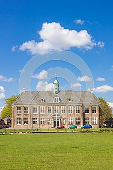 Front facade of the historic school building in Veendam photo