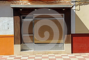 Closed store with facade in the style of the seventies of the 20th century in Calzada de Calatrava, Spain photo