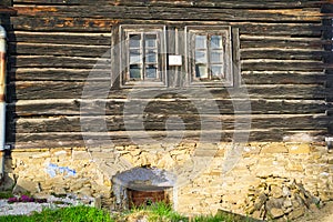 The front face of old wooden house in Pavlany village in Spis region in Slovakia