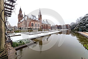 Front frozen Peace Palace garden, International Court of Justice, under the Snow