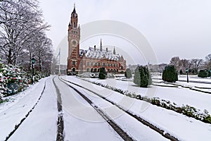 Front frozen Peace Palace garden, International Court of Justice, under the Snow