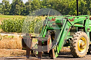 Front of green farm tractor