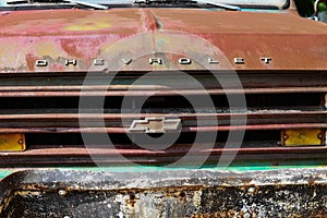 Front grill of an old rusty chevy truck