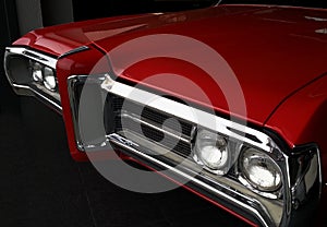 Front grille of red vintage car