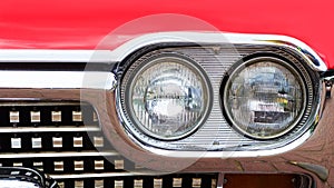 Front headlight of an old retro retro car. Close-up. Motor transport.