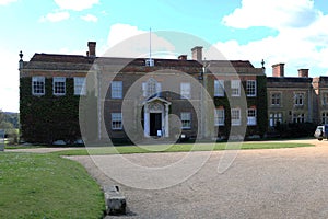 Front of Hinton Ampner with gravel drive