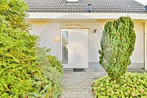 the front of a house with a white door