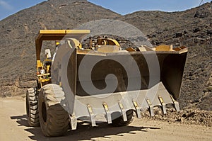 Front loader with over-sized square bucket