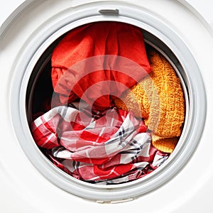 Washing machine or washer full of colored washables photo