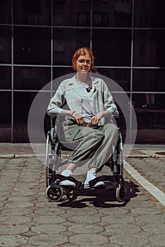 In front of a modern corporate building, a young woman sitting in a wheelchair confidently, symbolizing empowerment