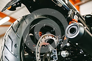 Front motorcycle disk breaks and tire in close up