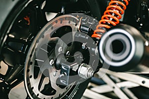 Front motorcycle disk breaks and tire in close up