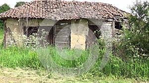 In front of the old and abandoned hut