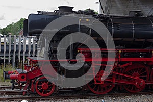 Front of a old historic steam black locomotive photo
