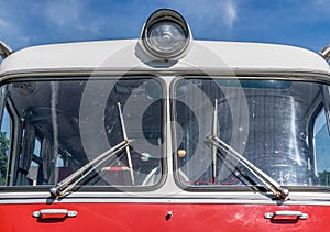 The front of an old soviet made red bus