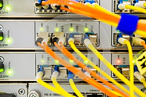 Front panel of the central router. Optical links of a powerful Internet server. Connection of optical wires in the data center
