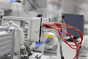 Front panel of electrical equipment with commutation wires and devices