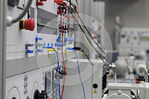 Front panel of electrical equipment with commutation wires and devices