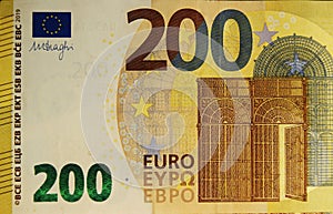 Front part of 200 euro banknote close-up with small details. European currency.