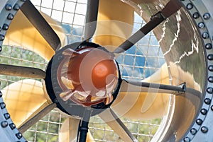 Front part of the snow cannon on a ski slope, detail of the protection mesh and the blades in a duct. Detail of ducted fan of a photo