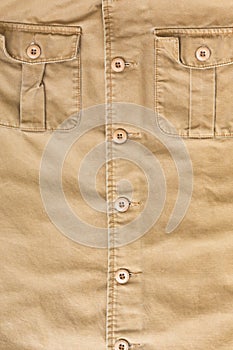 Front pocket on brown shirt textile texture