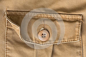 Front pocket on brown shirt textile texture