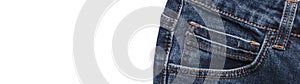 Front pocket of dark blue jeans isolated on white background. Close up shot. Copy space. Banner size. Clothing concept