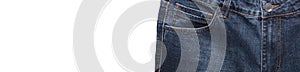 Front pocket, waist area, zipper, and its button of dark blue jeans isolated on white background. Close up shot. Copy space.