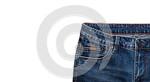 Front pocket, waist area, zipper, and its button of dark blue jeans isolated on white background. Close up shot. Copy space.