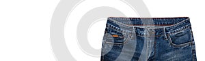 Front pockets, waist area, zipper, and its button of dark blue jeans isolated on white background. Close up shot. Copy space.
