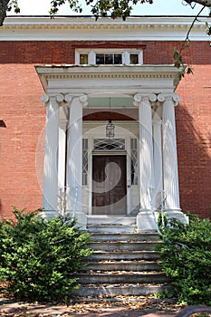 A front porch of a classic colonial style house