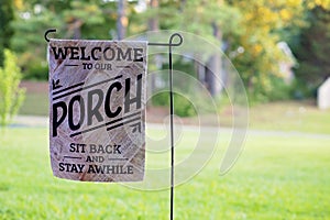 Front Porch Flag Sign With Rural Woods Background