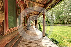 Front porch of the old rustic log cabin.