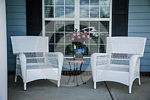 Front Porch Relaxation Wicker Chairs and Flowers